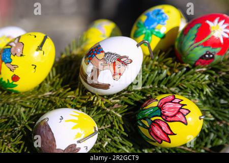Easter fountain decorated with 2900 real painted Easter eggs in Teuchatz in Franconian Switzerland, Bavaria, Germany Stock Photo