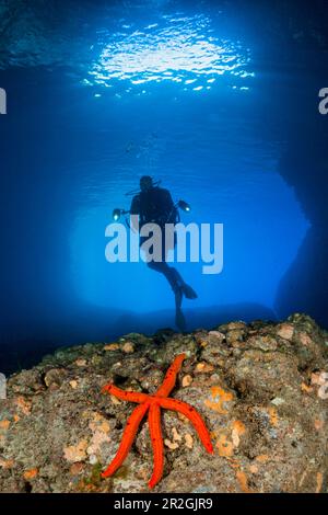 Divers in Green Cave, Vis Island, Mediterranean Sea, Croatia Stock Photo