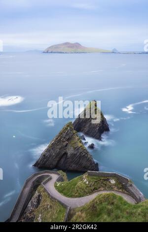 Winding path to Dunquin Pier and sea stacks. Ballyickeen Commons, County Kerry, Ireland. Stock Photo