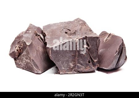 Large pieces of raw, dark chocolate isolated on white background Stock Photo