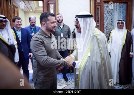 Jeddah, Saudi Arabia. 19th May, 2023. Ukrainian President Volodymyr Zelenskyy, left, greets Kuwait Crown Prince Mishal Al-Ahmad Al-Jaber Al-Sabah, right, before their bilateral meeting on the sidelines of the Arab League Summit, May 19, 2023 in Jeddah, Saudi Arabia. Zelenskyy attended the annual summit meeting as part of a broader pitch for global support against the Russia invasion of Ukraine. Credit: Pool Photo/Ukrainian Presidential Press Office/Alamy Live News Stock Photo
