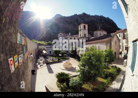 Square with Church of Saint Mary, Old Town of Kotor in the inner bay of Kotor Bay, Montenegro Stock Photo