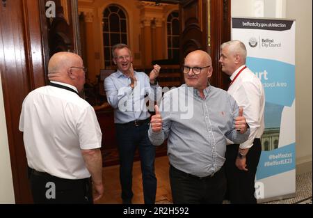 DUP candidate Ian McLaughlin (2nd right), who has won a seat, at Belfast City Hall during the Northern Ireland council elections. Picture date: Friday May 19, 2023. Stock Photo