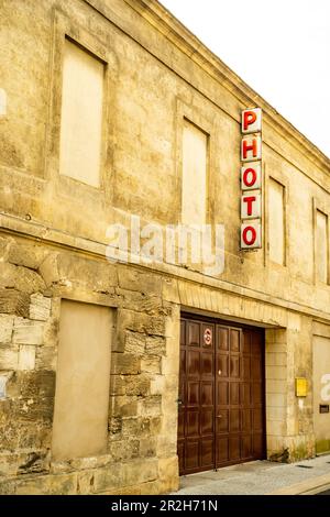 Old photo sign on a wall. Stock Photo