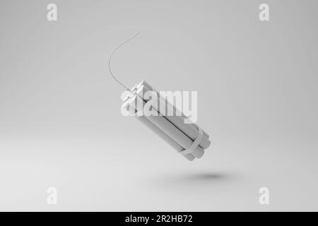 Bundle of dynamite sticks floating in mid air with shadow on white background in monochrome. The concept of explosion, terrorism and violence Stock Photo