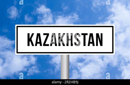 Kazakhstan road sign on cloudy sky background Stock Photo