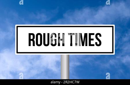 Rough times road sign on sky background Stock Photo