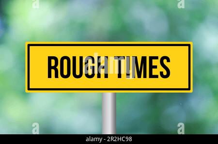 Rough times road sign on blur background Stock Photo