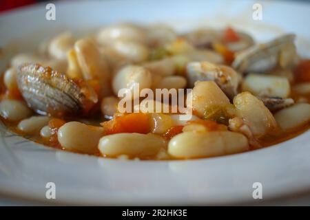 tasty and healthy dish of beans with clams Stock Photo