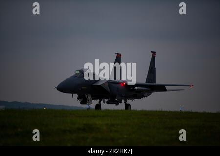 An F-15E Strike Eagle assigned to the 391st Fighter Squadron taxis down the flightline at Kadena Air Base, Japan, May 17, 2023. Throughout the week, the Strike Eagles flew evening sorties in support of the bilateral exercise, Southern Beach. Night flying operations hone the skills necessary for aircrew to successfully fly and fight in low to no visibility environments. (U.S. Air Force photo by Staff Sgt. Jessi Roth) Stock Photo