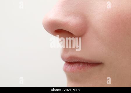 Woman with dry skin on white background, closeup of mouth Stock Photo