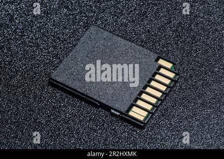 Close up of SD Card on black textured background Stock Photo