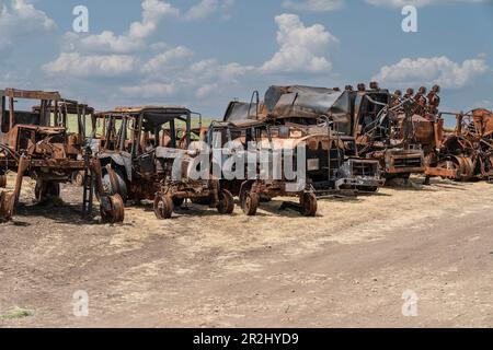 View of the destructions of agricultural equipment of Farm Pershe Travnia of village Velyka Oleksandrivka of Kherson region seen after liberation from Russian invasion. The farm was producing grain (wheat, barley, sunflower), meat (pork), and other products; with 100 employees and more than 3,000 hectares of fields, more than 1200 pigs. The farm was completely destroyed, all equipment, harvest from 2021, fertilizer, all buildings including storages for grain and places where pigs were kept and fed. After bombing pigs were either burned alive, some in panic jumped into the well. Serhiy Kosyuk e Stock Photo