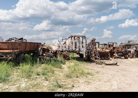 May 19, 2023, Kherson region, Ukraine: View of the destructions of agricultural equipment of Farm Pershe Travnia of village Velyka Oleksandrivka of Kherson region seen after liberation from Russian invasion. The farm was producing grain (wheat, barley, sunflower), meat (pork), and other products; with 100 employees and more than 3,000 hectares of fields, more than 1200 pigs. The farm was completely destroyed, all equipment, harvest from 2021, fertilizer, all buildings including storages for grain and places where pigs were kept and fed. After bombing pigs were either burned alive, some in pani Stock Photo