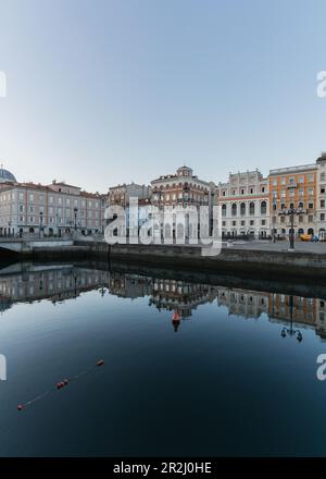 Just after sunrise on the Grand Canal in Trieste, Friuli Venezia Giulia, Italy. Stock Photo