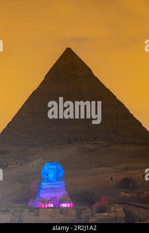 The Great Sphinx of Giza and The Pyramid of Khafre illuminated, UNESCO World Heritage Site, Giza, Egypt, North Africa, Africa Stock Photo