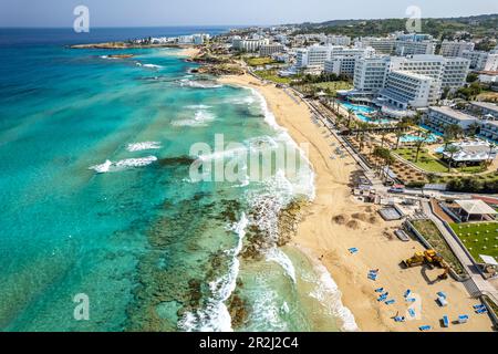 Hotels at Vrissiana and Sunrise Beach seen from the air, Protaras, Cyprus, Europe Stock Photo