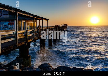 Evening mood at the Swakopmund jetty in western Namibia, Africa Stock Photo