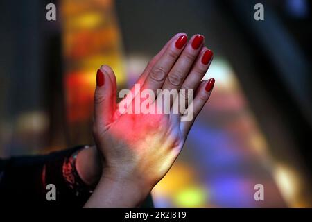 Close up of hands of woman praying in a church, Turckheim, France, Europe Stock Photo
