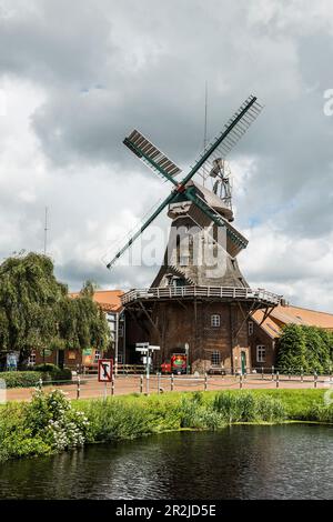 Canal with windmill, Westgrossefehn, Großefehn, East Friesland, Lower Saxony, Germany Stock Photo
