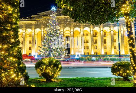 Main Christmas tree of capital city of Georgia Tbilisi on Rustaveli avenue in front of Parliament building Stock Photo