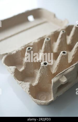 egg carton without eggs on table , Stock Photo