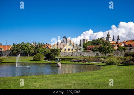 Lake with fountain in Almedalen Park in the old town, Visby, Gotland, Sweden, Europe Stock Photo