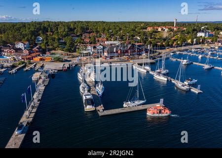 Aerial view of tender boat from expedition cruise ship World Voyager (nicko cruises) approaching marina, Sandhamn, Stockholm archipelago, Sweden, Euro Stock Photo