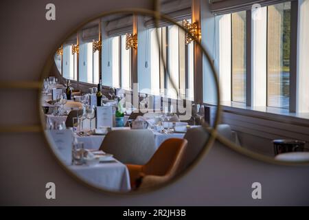 Reflection of the table decoration for the captain's dinner in the restaurant of river cruise ship Excellence Empress (travel agency Mittelthurgau) on the Danube, near Ybbs ad Donau, Wachau, Lower Austria, Austria, Europe Stock Photo