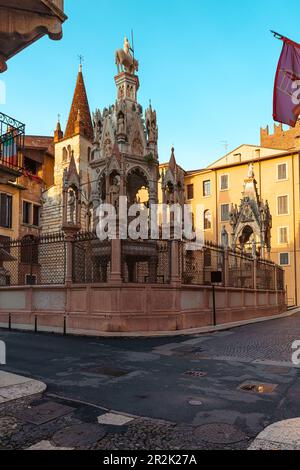 Medieval street in old town of Verona with Scaliger tombs. Gothic monuments. Popular touristic landmark. Vertical orientation. Travel destination Stock Photo