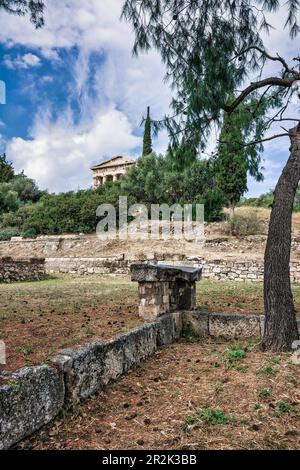 Remote view of the temple of Hephaestus in Ancient Agora, Athens, Greece. The Temple of Hephaestus is the best preserved ancient temple in Greece. It Stock Photo