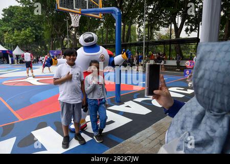 Jakarta, Indonesia. 20th May, 2023. Kids pose with JIP, the official mascot of FIBA Basketball World Cup 2023, during the Revamp My Court program in Jakarta, Indonesia, May 20, 2023. Revamp My Court program is a process of refurbishment of the host city's local basketball court with the aim of leaving a legacy, as part of a pre-event series toward the FIBA World Cup 2023 in three host countries Japan, Indonesia, and the Philippines. Credit: Zulkarnain/Xinhua/Alamy Live News Stock Photo