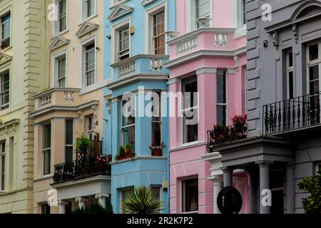 LONDON, GREAT BRITAIN - SEPTEMBER 20, 2014: This is architecture and multi-colored coloring houses in the now prestigious district of Notting Hill. Stock Photo