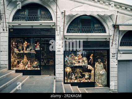 Carnival masks and costumes shop on Rialto bridge Venice Italy Stock Photo