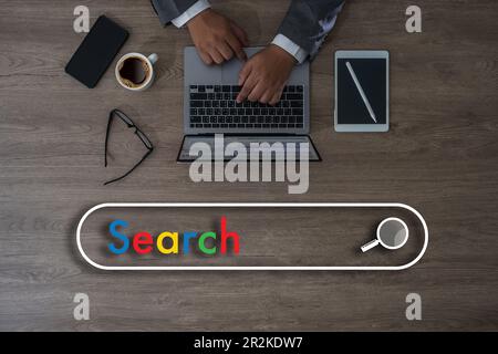 man search job on laptop computer device online browse internet webpage research find global Data Search Technology Search Engine Optimization (SEO) N Stock Photo