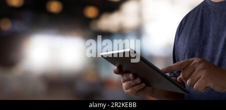 man and hands using digital tablet technology finger touch screen smart communication connecting wifi see multimedia or job copy space Stock Photo