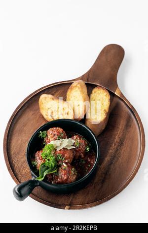 polpette al sugo traditional italian meatballs in tomato sauce on white background Stock Photo