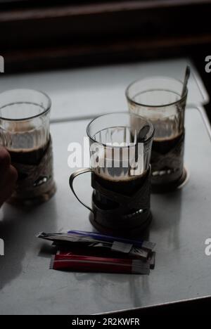 View of cups of tea on table in the train Stock Photo