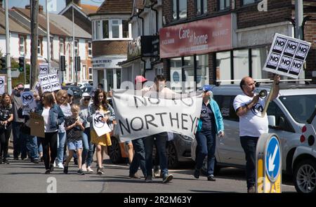 Bexhill, East Sussex, UK. 20th May, 2023. Following a decision by Conservative immigration Minister Robert Jenrick to name the former prison site at Northeye in Bexhill East Sussex as an accommodation centre for 1200 asylum seekers, local residents marched from Cooden Memorial roundabout to the Rother District town hall demanding their MP Huw Merriman intervenes and forces the Minister to reconsider the matter. Credit: Newspics UK South/Alamy Live News Stock Photo