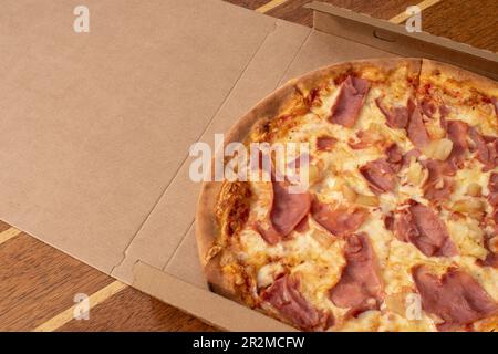 05.04.2023. vienna, austria. Pic of Packet Assistant hawaii pizza with tomato sauce, cheese, ham, pineapple Stock Photo