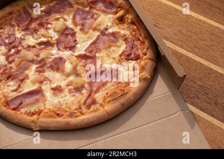 05.04.2023. vienna, austria. Pic of Packet Assistant hawaii pizza with tomato sauce, cheese, ham, pineapple Stock Photo