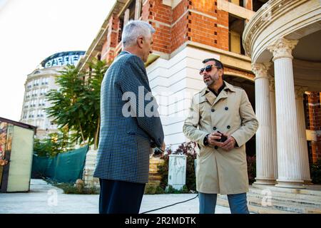 Amazing two senior businessmen are talking about the company plans Stock Photo