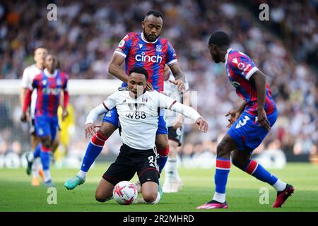 Fulham's Kenny Tete goes down ahead of Crystal Palace's Jordan Ayew during the Premier League match at Craven Cottage, London. Picture date: Saturday May 20, 2023. Stock Photo