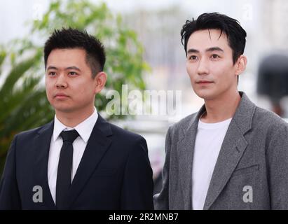 Cannes, France. 20th May, 2023. Chinese director Wei Shujun (L) and actor Zhu Yilong pose during a photocall for the film 'He Bian De Cuo Wu' (Only the River Flows) in competition for the category Un Certain Regard at the 76th edition of the Cannes Film Festival in Cannes, southern France, on May 20, 2023. Credit: Gao Jing/Xinhua/Alamy Live News Stock Photo