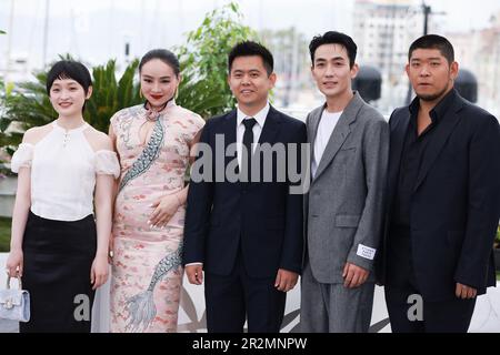 Cannes, France. 20th May, 2023. Chinese director Wei Shujun (C), actor Zhu Yilong (2nd R), actress Chloe Maayan (2nd L), actor Tong Linkai (1st R), and actress Liu Baisha (1st L) pose during a photocall for the film 'He Bian De Cuo Wu' (Only the River Flows) in competition for the category Un Certain Regard at the 76th edition of the Cannes Film Festival in Cannes, southern France, on May 20, 2023. Credit: Gao Jing/Xinhua/Alamy Live News Stock Photo