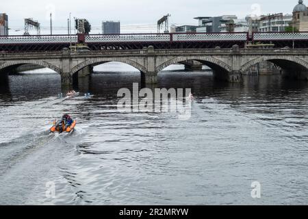 Glasgow, Scotland, UK. 20th May, 2023. The Scottish Boat Race is an annual rowing race over 2km on The River Clyde between the University of Glasgow and the University of Edinburgh. The race starts at the South Portland Street Suspension Bridge and finishes at the Glasgow Science Centre Tower. The event consists of six different races:  a mixed graduate, a men’s novice & second eight, a women’s novice & second eight, men’s first eight, women's first eight and an ergometer team race. Credit: Skully/Alamy Live News Stock Photo