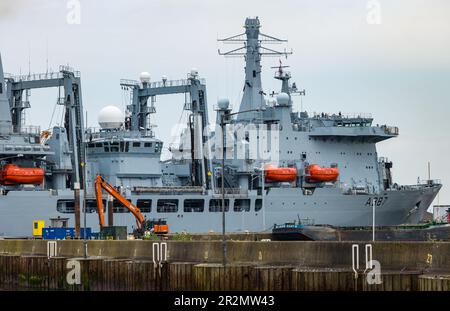 Edinburgh, Scotland, UK, 20th May 2023. RFA Fort Victoria (A387) enters Leith harbour: the combined fleet stores ship and tanker of the Royal Fleet Auxiliary of the United Kingdom tasked with providing ammunition, fuel, food and other supplies to British Royal Navy vessels is manoeuvred into the harbour to a mooring by tug boats. Credit: Sally Anderson/Alamy Live News Stock Photo