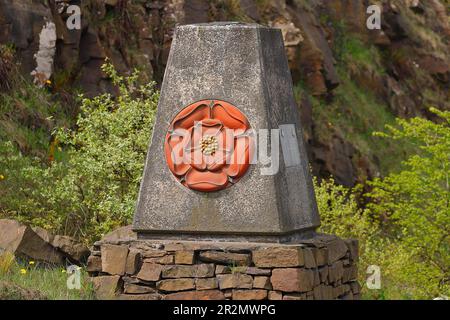 Red Rose of Lancashire on a concrete pillar by the M62 on the border of Yorkshire & Lancashire & unveiled by Queen Elizabeth II on 14/10/1971 Stock Photo