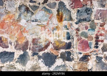 Old rough rock wall, abstract background or texture. Stock Photo
