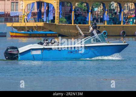 Indian Navy Marine Commandos (MARCOS) patrol on the waters of Dal Lake ahead of the upcoming G20 meeting in Srinagar. A meeting of delegates from G20 nations will be held in Srinagar from 22 to 24 May, with tightened security measures in the Himalayan disputed region. This meeting will be the first major international event in Jammu and Kashmir since New Delhi scrapped its special status in 2019. India's decision to host a meeting of G20 countries in Srinagar has been slammed by Pakistan, which called it an 'irresponsible move' saying the move is the latest in a series of self serving measures Stock Photo